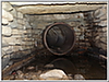 35up-A large 24 inch diameter pipe straight ahead.  Is this the end of the line?  Look at the large stone above the pipe