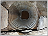 4down-38' downhill, a pipe entering from the ceiling of the tunnel